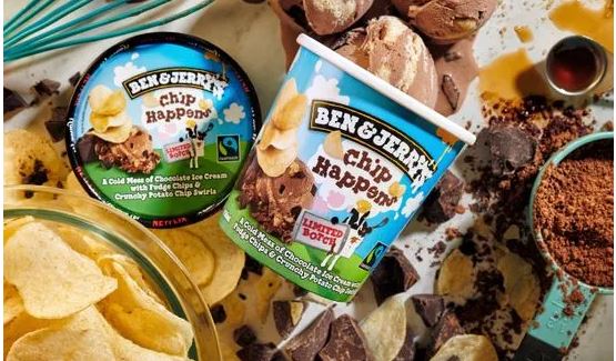 Ben and Jerry's ice cream, chips, and chocolate on a table