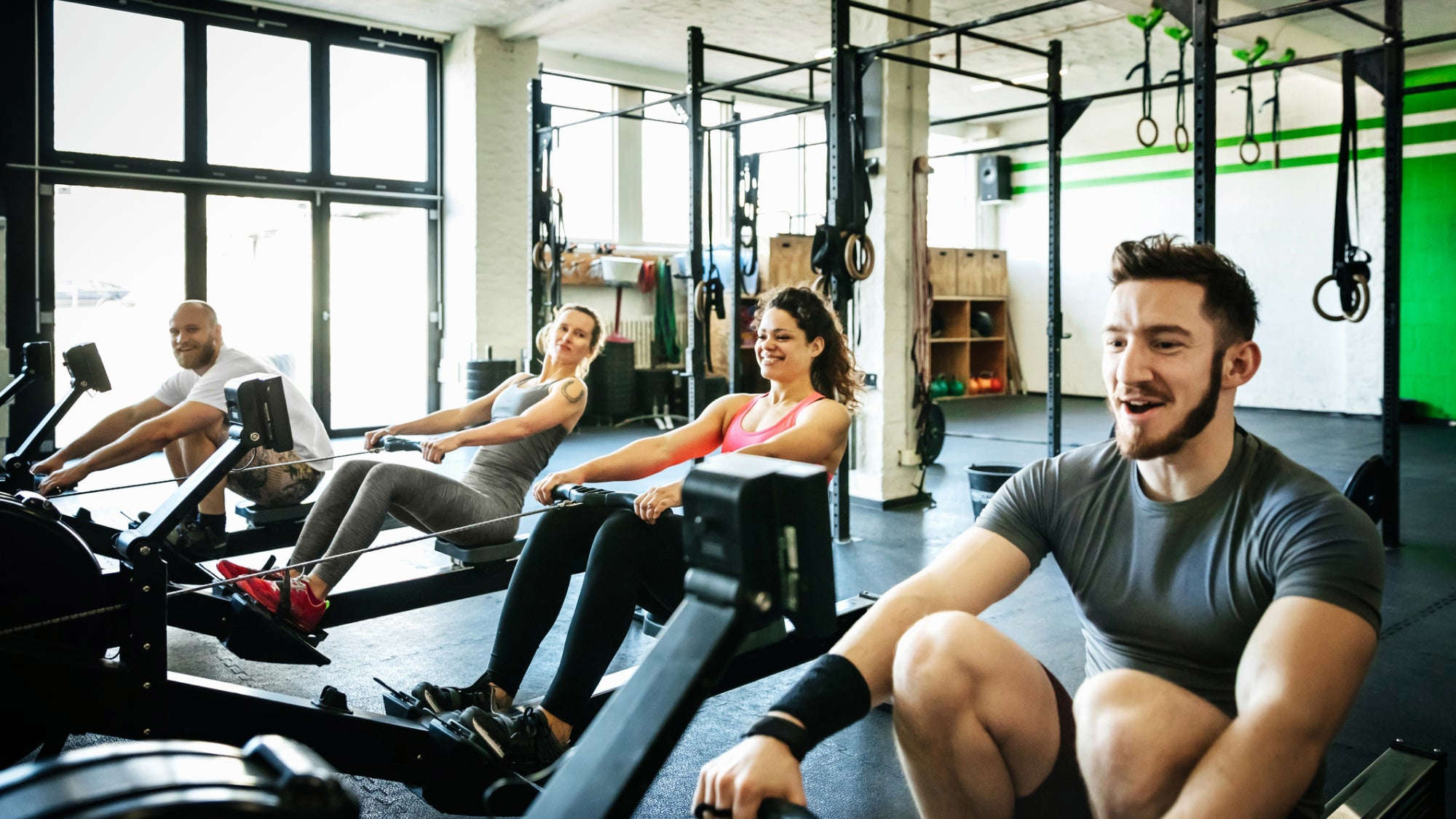Men and women in a fitness gym with a fitness coach