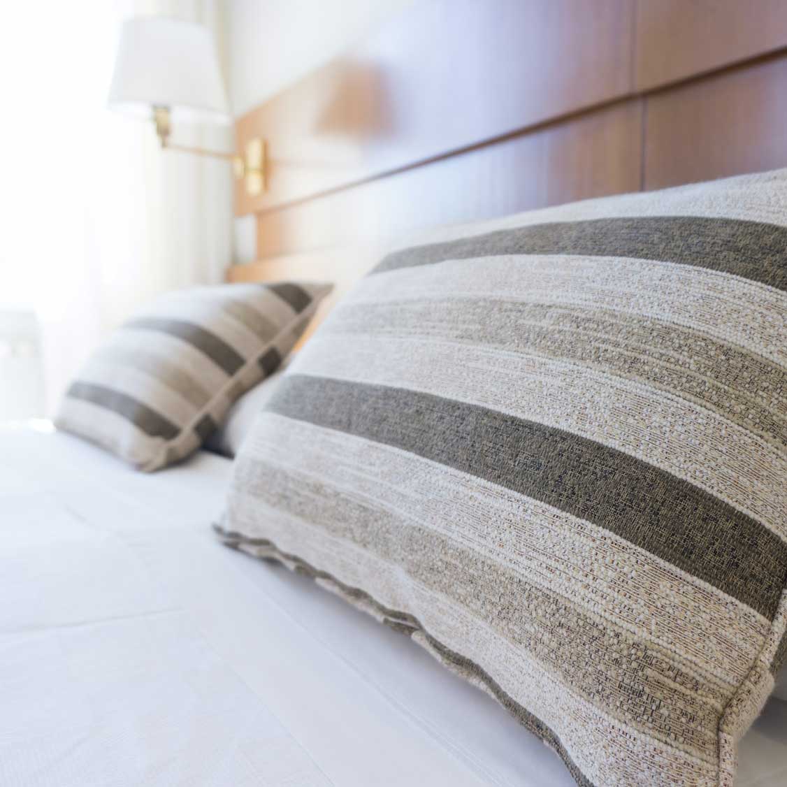 Image of gray hotel pillows.