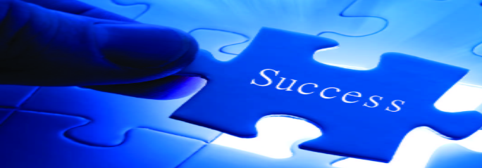 Image of a person holding a blue puzzle piece with the word 'success' written on it.